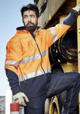 Man wearing Orange/Navy Hi Vis Softshell Jacket with reflective tape
